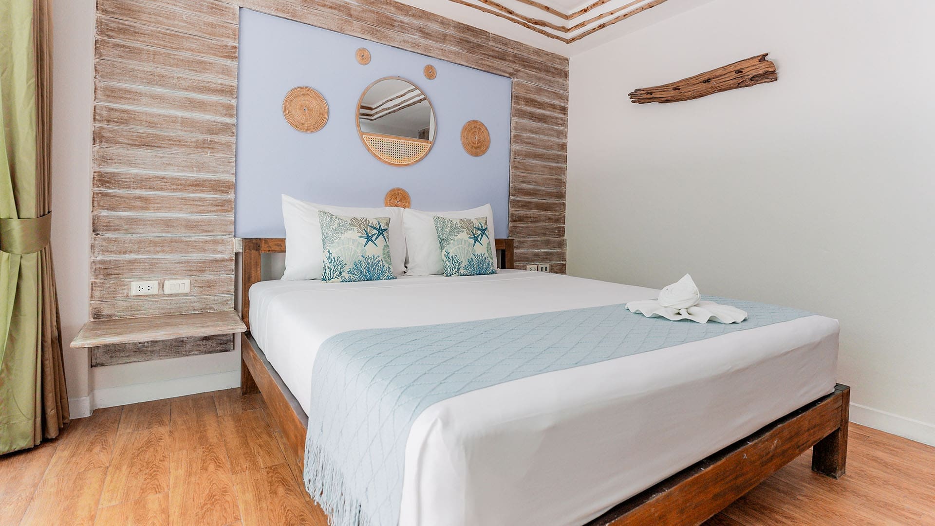 Deluxe room at ARKbar Beach Resort with a double bed and a private balcony