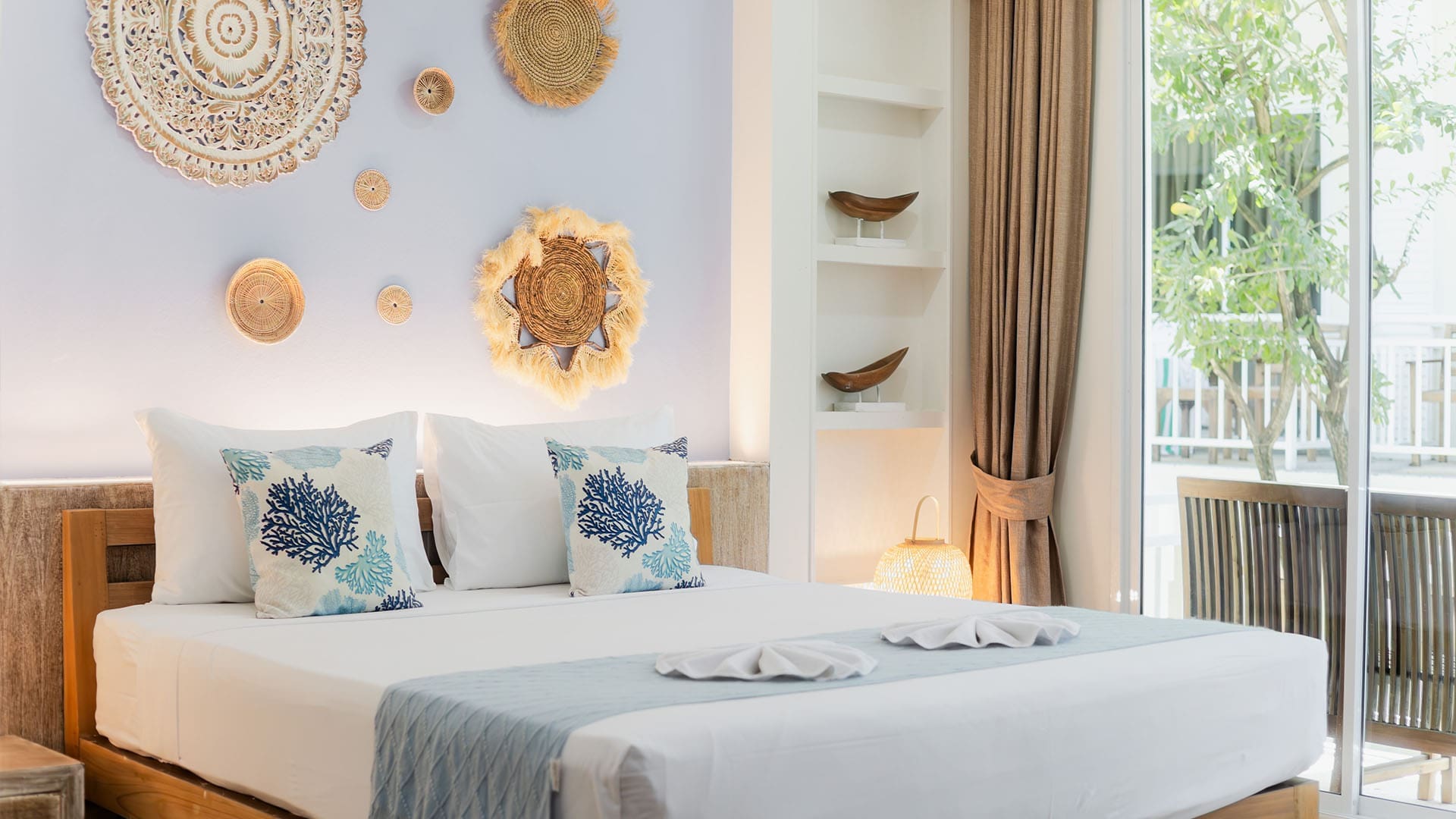 Premier Deluxe room at ARKbar Beach Resort with a queen bed, sofa and balcony