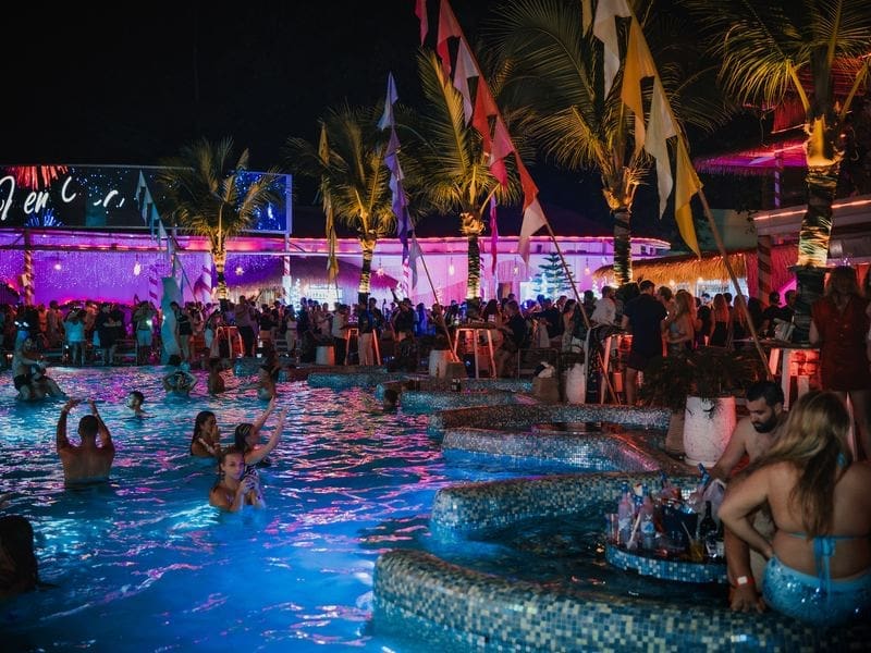Guests in the ARKbar beachfront pool on New Year's Eve