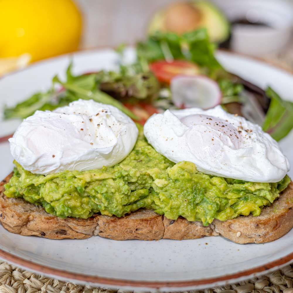 A breakfast plate of eggs, avocado and toast at ARKbar